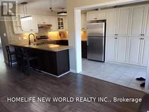 Markham (Cornell) townhouse for rent - A kitchen with a refrigerator in the background.