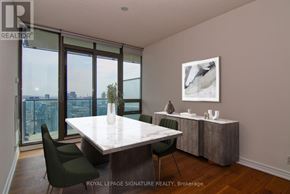 Toronto (Church-Yonge Corridor) condo for rent - A dining room with a table and chairs and a view of the city.