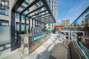 Toronto (Kensington-Chinatown) condo for rent - A modern outdoor seating area with a pool table and comfortable seating.