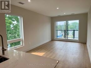 Thorold (Thorold Downtown) apartment for rent - A kitchen with a stainless steel oven and microwave above it.