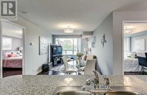 Toronto (Woburn) condo for rent - A modern kitchen with granite countertops and stainless steel appliances.