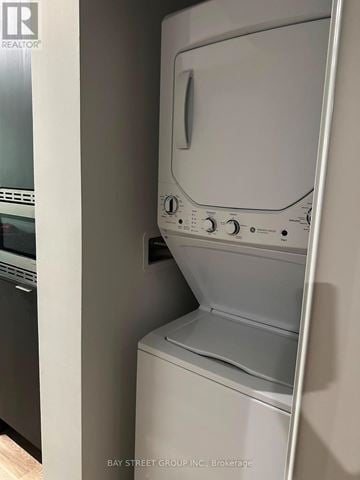 Mississauga (Cooksville) condo for rent - A white dishwasher is sitting in a kitchen.