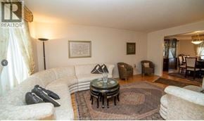 Windsor apartment for rent - A living room with a sofa, chairs, and a coffee table.