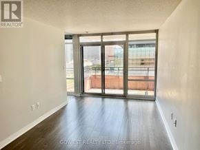 Toronto (Waterfront Communities) condo for rent - A room with a sliding glass door leading to a balcony.