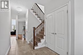 London South (South K) apartment for rent - A white hallway with a staircase and a door.