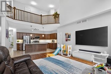 London South (South K) apartment for rent - A living room with a brown leather couch and a white entertainment center.
