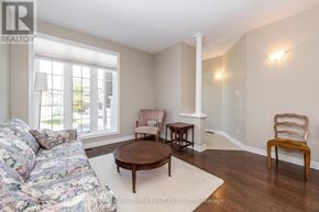 Ottawa townhouse for rent - A living room with a couch, chair, and table.