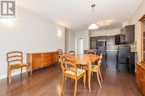 Ottawa townhouse for rent - A dining room with a wooden table and chairs.