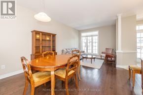 Ottawa townhouse for rent - A dining room with a wooden table and chairs.