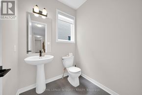 Ottawa apartment for rent - A white sink and toilet in a small bathroom.
