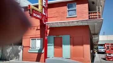 Reno apartment for rent - A red building with a sign that says "Vacancy" is shown.