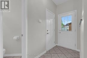Ottawa townhouse for rent - A white door is in a room with a window.