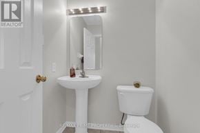 Ottawa townhouse for rent - A white sink and toilet in a bathroom.