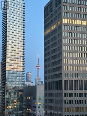 Toronto (Bay Street Corridor) condo for rent - A tall building with the words "Your Condos Realty Inc. Brokerage" on it.