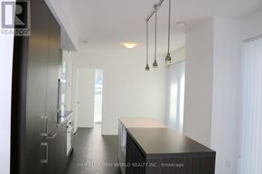 Toronto (Waterfront Communities) condo for rent - A modern kitchen with a long island in the middle.