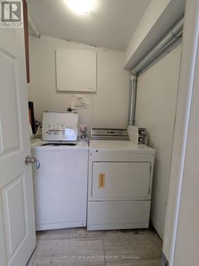 Toronto (Corso Italia-Davenport) apartment for rent - A small white laundry room with a washer and dryer.