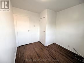 Toronto (Corso Italia-Davenport) apartment for rent - A room with white walls and wood flooring, with a door on the left and a closet on the right.