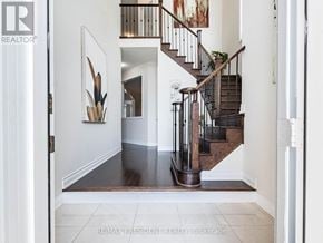 Halton Hills (Georgetown) apartment for rent - A hallway with a staircase and a painting on the wall.