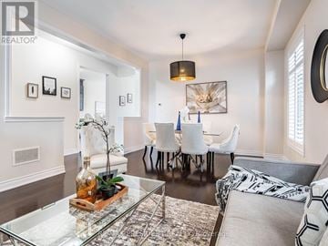Halton Hills (Georgetown) apartment for rent - A living room with a glass coffee table and a grey couch.