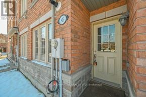 Brampton (Sandringham-Wellington) townhouse for rent - A brick house with a door and a number 45 on the wall.