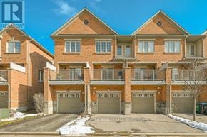 Brampton (Sandringham-Wellington) townhouse for rent - A large brick building with multiple garages is labeled as a realtor property.