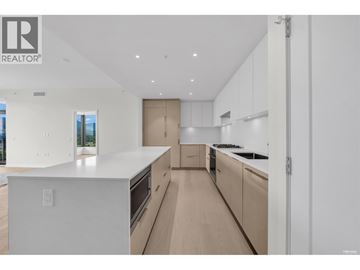 North Vancouver apartment for rent - A modern kitchen with white cabinets and a large island.