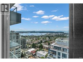 North Vancouver apartment for rent - A view from a high-rise building looking out over a cityscape.