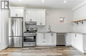 Hamilton (Gibson) apartment for rent - A white kitchen with a refrigerator, oven, and cabinets.