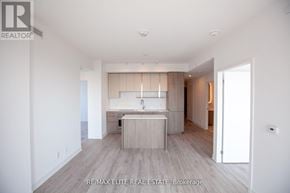 Toronto (Willowdale East) condo for rent - A spacious, modern kitchen with a sink and a countertop.