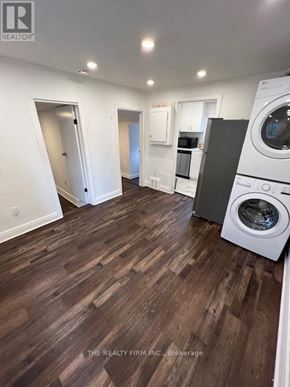 London South (South F) fourplex for rent - A laundry room with a washer and dryer.