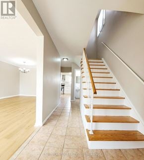 Toronto (Humbermede) apartment for rent - A long hallway with a staircase on the right side.