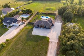 Winnipeg apartment for rent - A large house with a pool in the backyard.