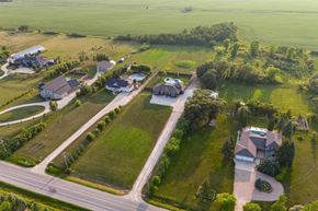 Winnipeg apartment for rent - A bird's eye view of a residential area with houses and green lawns.