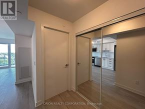 Pickering (Bay Ridges) condo for rent - A room with a sliding glass door leading to a balcony.