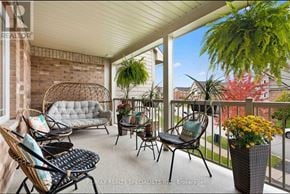 Innisfil (Alcona) townhouse for rent - A balcony with a couch, chairs, and plants.