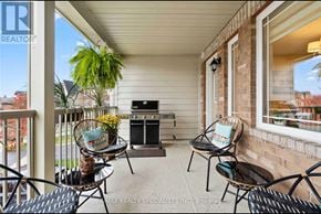 Innisfil (Alcona) townhouse for rent - A patio with chairs and a table with a plant on it.