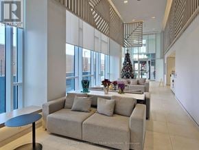 Toronto (Islington-City Centre West) condo for rent - A living room with a Christmas tree and a couch.