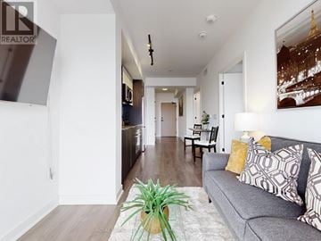 Toronto (Islington-City Centre West) condo for rent - A living room with a grey couch and a potted plant.