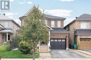 Mississauga (Churchill Meadows) apartment for rent - A house with a tree in front of it.