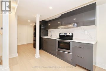 Mississauga (Churchill Meadows) apartment for rent - A modern kitchen with a stainless steel oven and microwave built into a countertop.