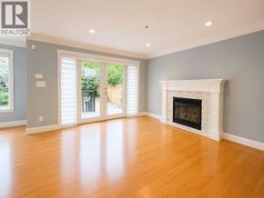 Vancouver apartment for rent - A living room with a fireplace and sliding glass doors.