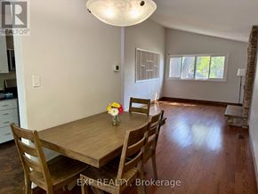 Toronto (Woburn) apartment for rent - A dining room with a wooden table and chairs.