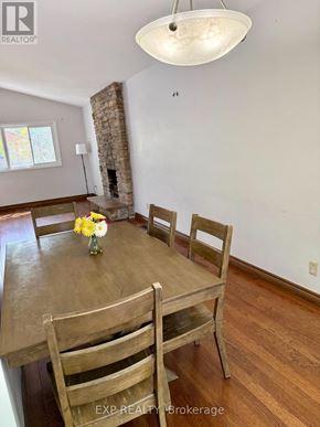 Toronto (Woburn) apartment for rent - A dining room with a wooden table and chairs.