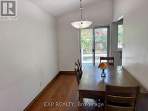 Toronto (Woburn) apartment for rent - A dining room with a wooden table and chairs.