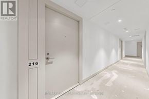 Toronto (Humber Heights) condo for rent - A white door with the number 216 on it.