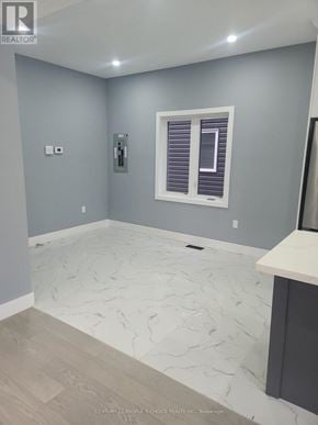 Hamilton (Mcquesten) apartment for rent - A room with a window and a marble floor.