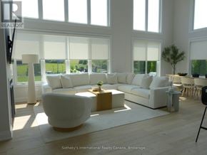 Blue Mountains apartment for rent - A living room with white furniture and large windows.