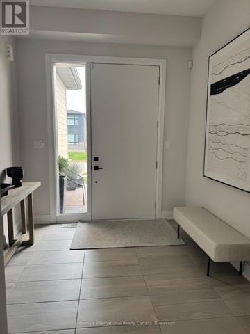 Blue Mountains apartment for rent - A living room with white furniture and large windows.