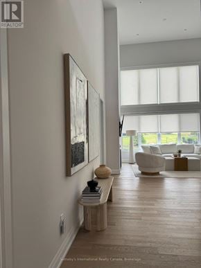 Blue Mountains apartment for rent - A dining room with a table and chairs in front of a large window.