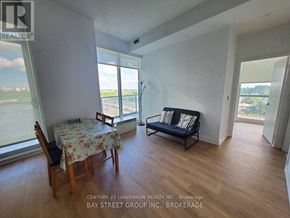 Toronto (Bayview Village) condo for rent - A living room with a couch, table and chairs.